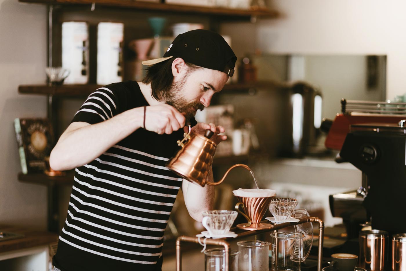 Barista pouring filter coffee